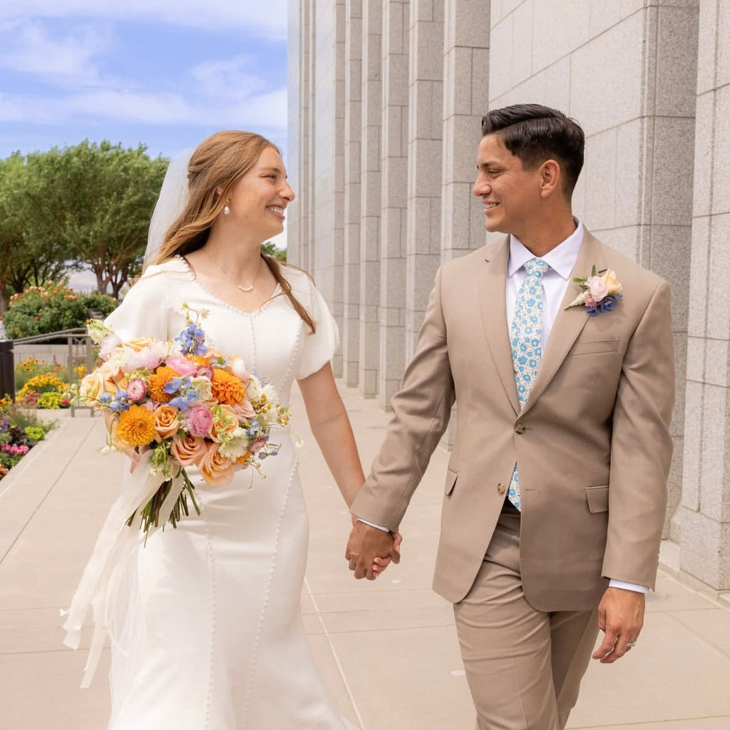 wedding photo with groom in blue floral tie