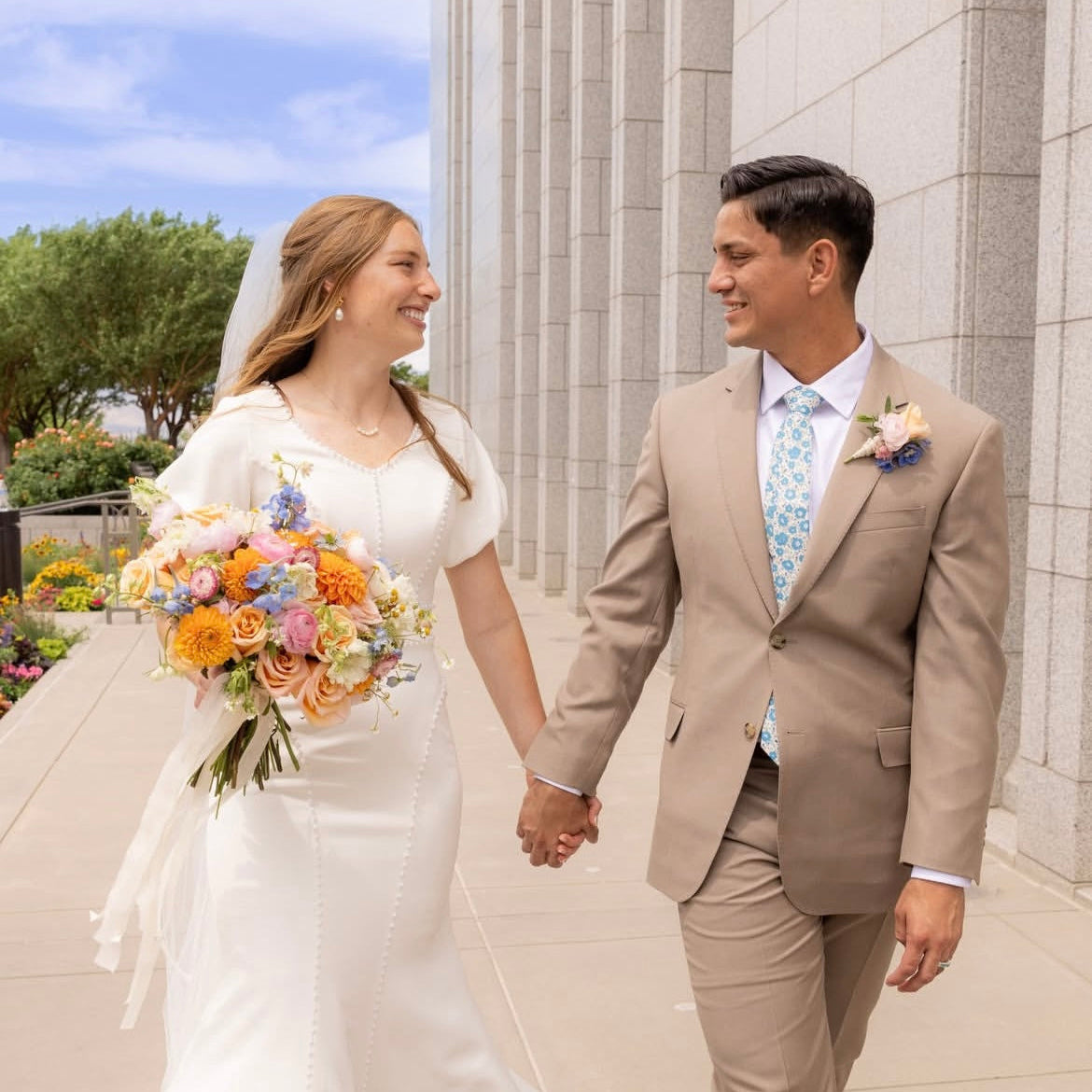 wedding photo with groom in blue floral tie