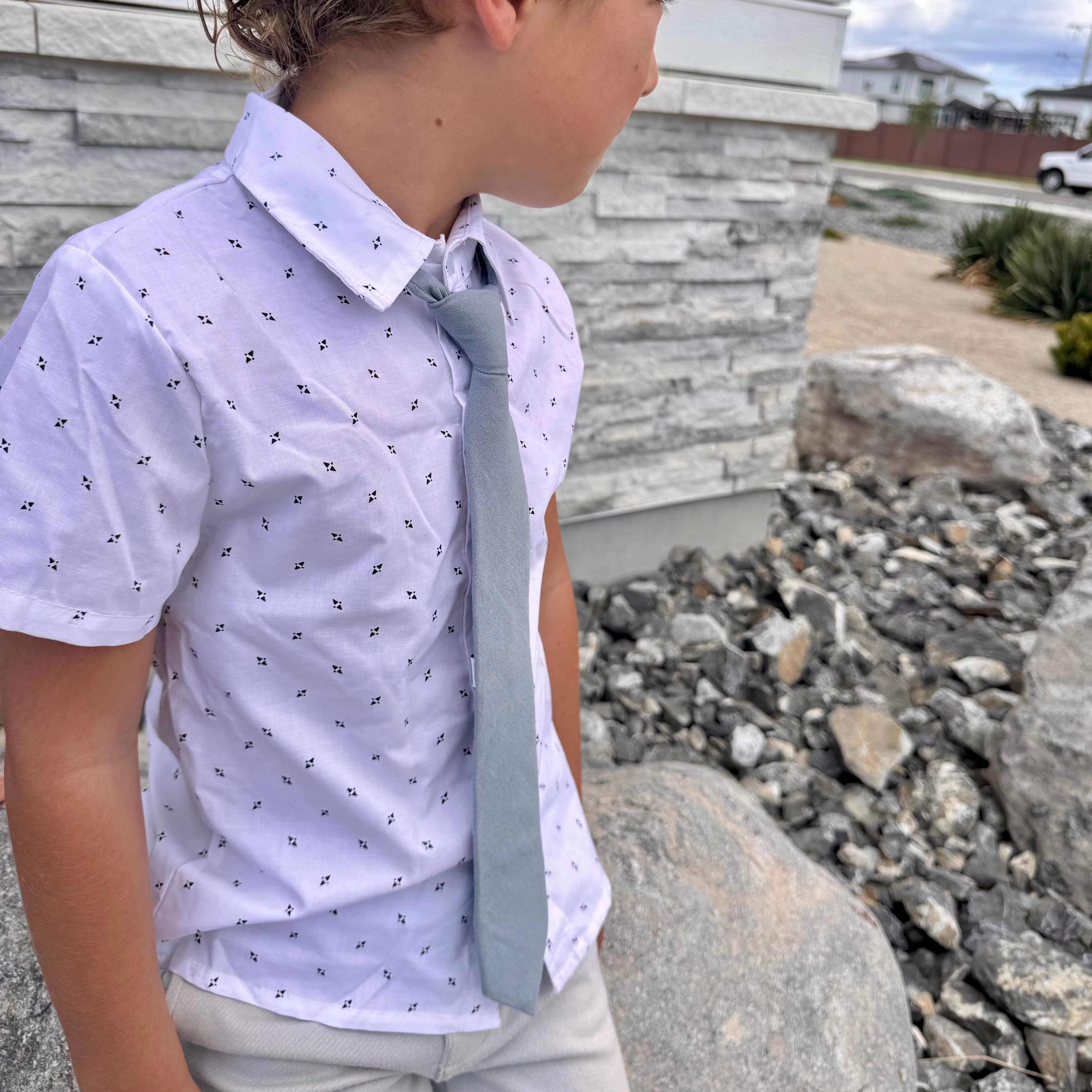 Young boy wearing dusty blue matchsox kids tie